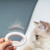 Pet Life 'Knuckler' Handheld Travel Flexible Grooming Pet Rake Comb - Pink